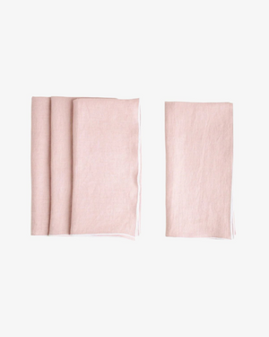 Rosewater stone washed linen napkin in soft pink with white surged stitch edge, set of 4